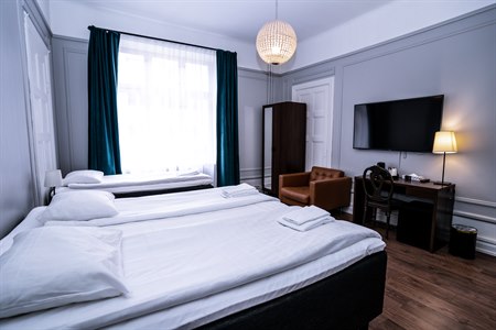 Tremannsrom Queens Hotel. Bilde.